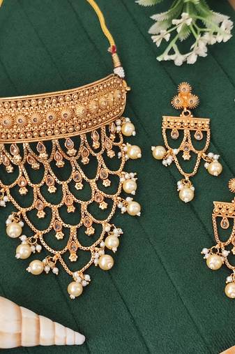 Designer antique gold finish necklace set with intricate layered patterns