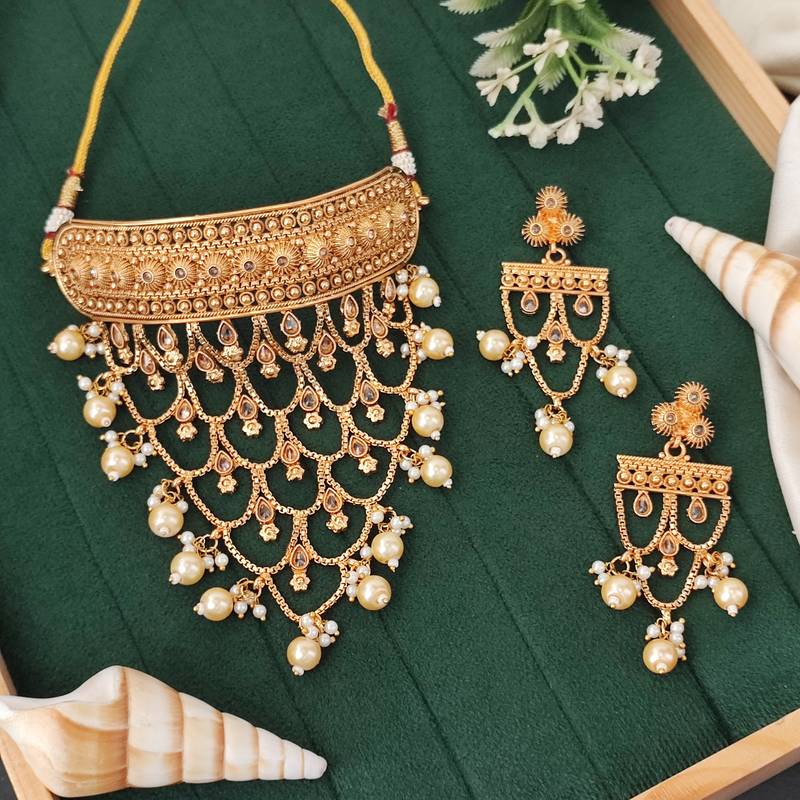 Designer antique gold finish necklace set with intricate layered patterns