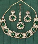 Emerald green kundan necklace set with earrings and maang tikka