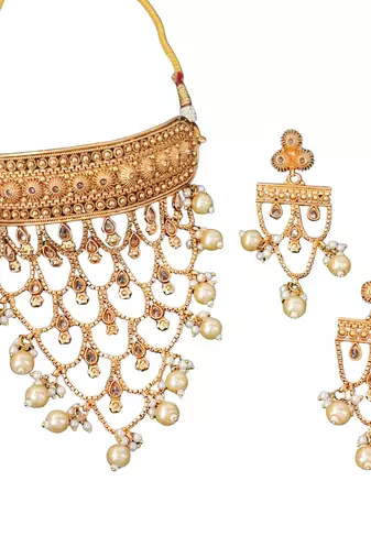 Designer antique gold finish necklace set with intricate layered patterns