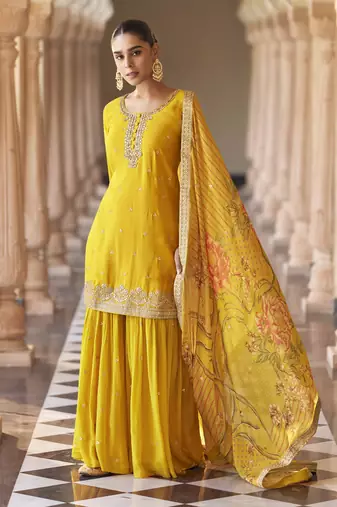 Yellow embroidered silk semi-stitch sharara suit with dupatta