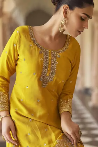 Yellow embroidered silk semi-stitch sharara suit with dupatta