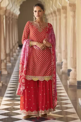 Red embroidered silk semi-stitch sharara suit with dupatta
