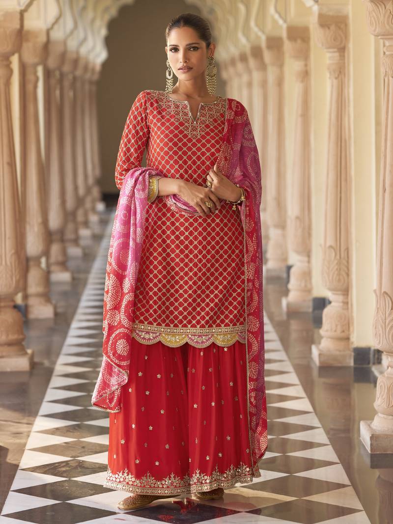 Red embroidered silk semi-stitch sharara suit with dupatta