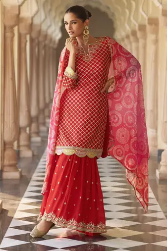 Red embroidered silk semi-stitch sharara suit with dupatta