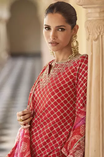 Red embroidered silk semi-stitch sharara suit with dupatta