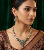 Traditional kundan & green stone necklace set with pearl accents & matching drop earrings for women