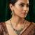 Traditional kundan & green stone necklace set with pearl accents & matching drop earrings for women