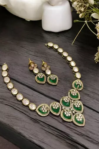 Traditional kundan & green stone necklace set with pearl accents & matching drop earrings for women
