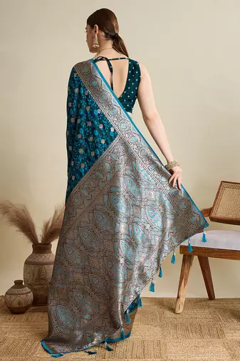 Teal blue woven embellished self design satin silk blend banarasi saree with blouse