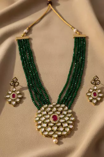  women gold plated green kundan jewellery set