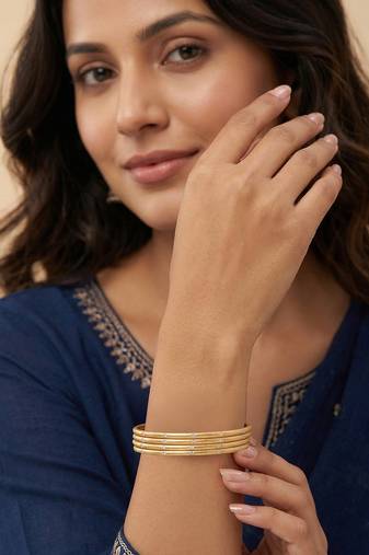  women set of 4 gold plated handcrafted cz studded bangle