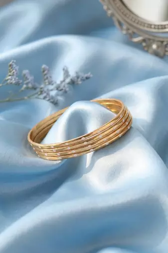  women set of 4 gold plated handcrafted cz studded bangle