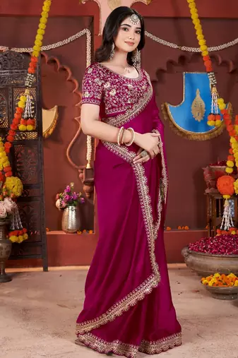 rani pink heavy embroidered silk blend party wear saree