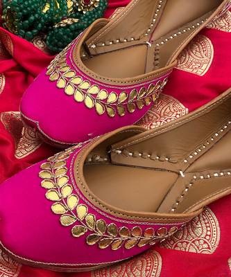 rani pink leather juttis with floral embroidered design 1