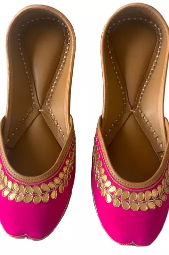 rani pink leather juttis with floral embroidered design