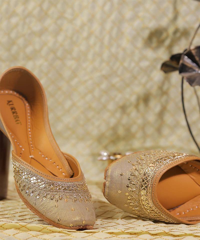 Muted gold embroidered leather juttis