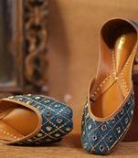 blue leather juttis with decorative thread and sequin work