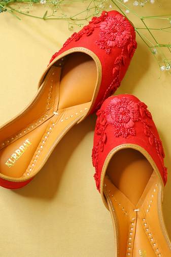Red embroidered leather juttis