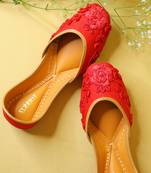 Red embroidered leather juttis
