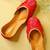 Red embroidered leather juttis