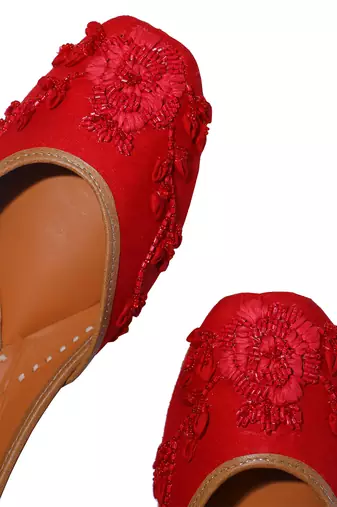 red ethnic leather juttis with floral embroidery work