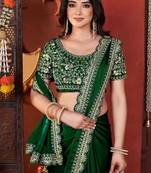 green heavy embroidered silk blend party wear saree