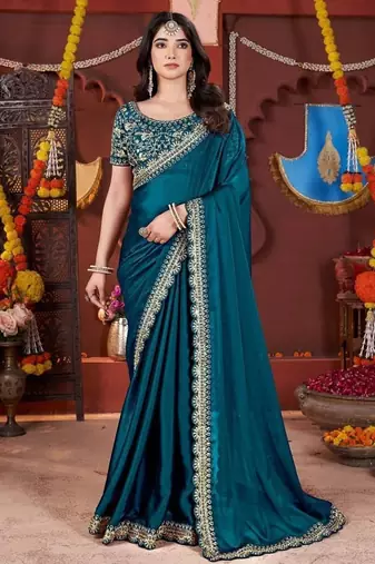 teal heavy embroidered silk blend party wear saree