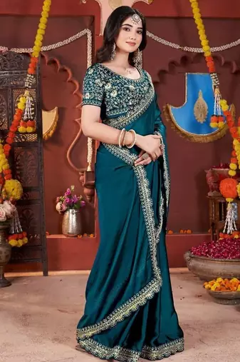 teal heavy embroidered silk blend party wear saree