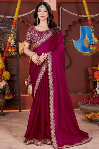 rani pink heavy embroidered silk blend party wear saree