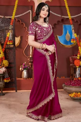 rani pink heavy embroidered silk blend party wear saree