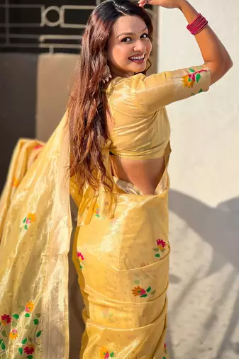 Yellow with multicolor accents  woven zari floral motifs work  silk blend   paithani style saree  with blouse piece