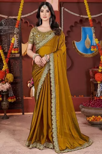 yellow heavy embroidered silk blend party wear saree