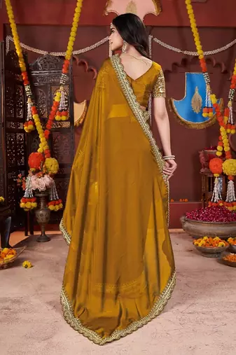 yellow heavy embroidered silk blend party wear saree