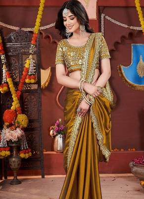 yellow heavy embroidered silk blend party wear saree 4