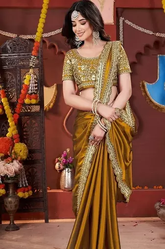 yellow heavy embroidered silk blend party wear saree