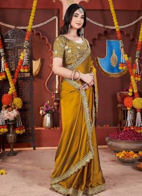 yellow heavy embroidered silk blend party wear saree 5