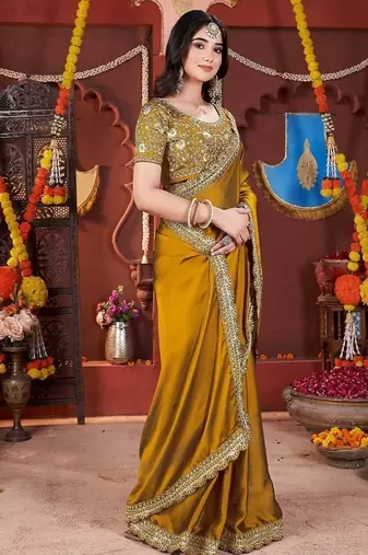 yellow heavy embroidered silk blend party wear saree
