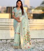 Light blue with multicolor accents  woven zari floral motifs work 
   paithani style saree  with blouse piece