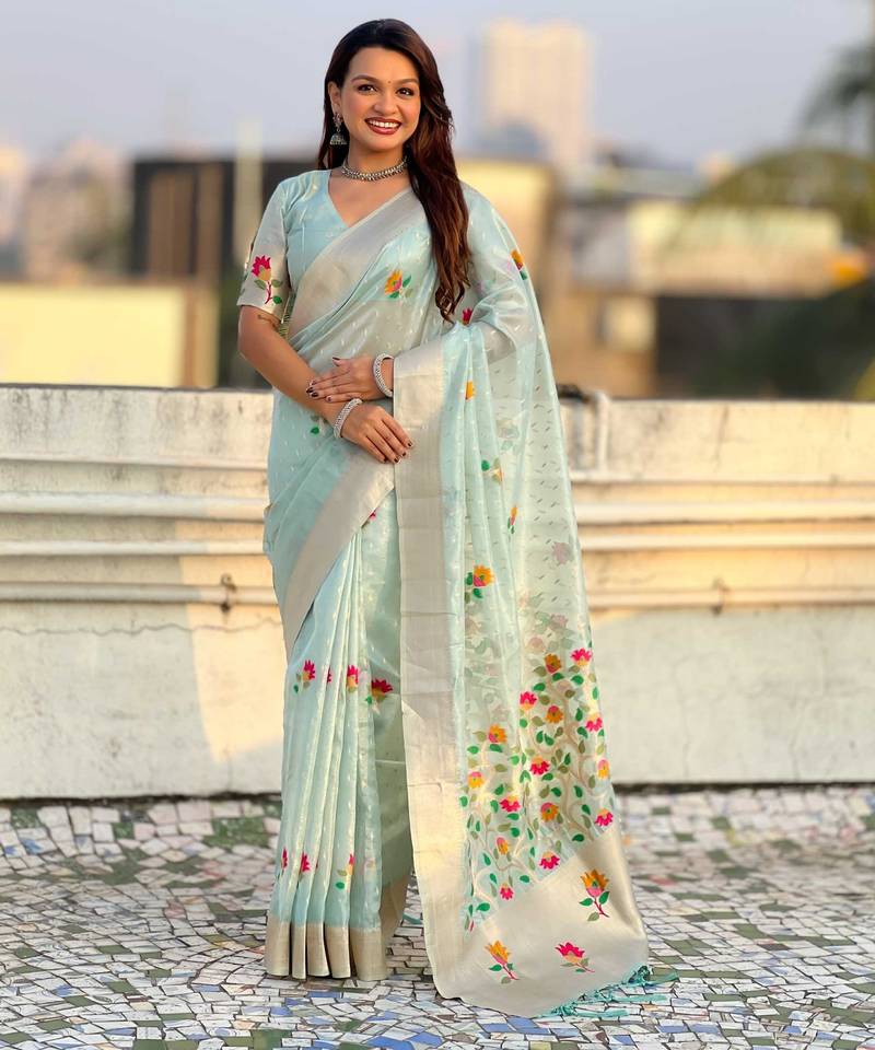 Light blue with multicolor accents  woven zari floral motifs work 
   paithani style saree  with blouse piece