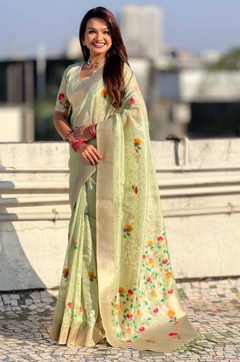 Green with multicolor accents  woven zari floral motifs work
 paithani style saree  with blouse piece