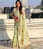 Green with multicolor accents  woven zari floral motifs work
 paithani style saree  with blouse piece