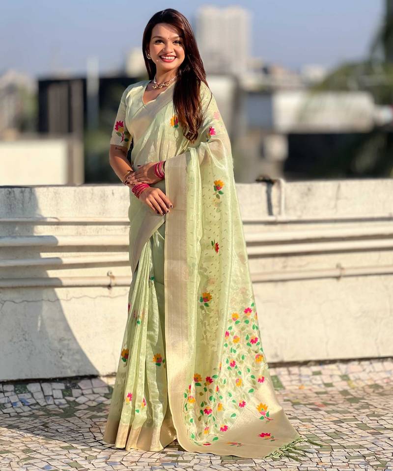 Green with multicolor accents  woven zari floral motifs work
 paithani style saree  with blouse piece