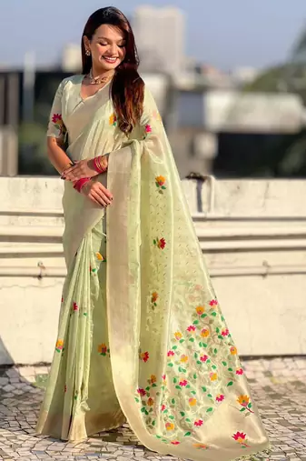Green with multicolor accents  woven zari floral motifs work
 paithani style saree  with blouse piece