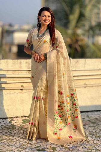 Cream with multicolor accents  woven zari floral motifs work   paithani style saree