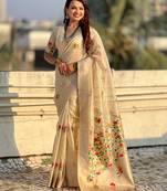 Cream with multicolor accents  woven zari floral motifs work   paithani style saree