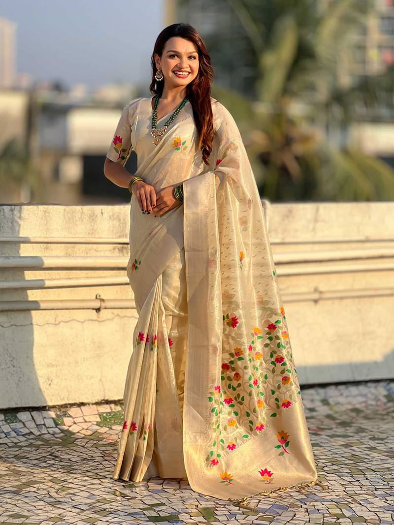 Cream with multicolor accents  woven zari floral motifs work   paithani style saree