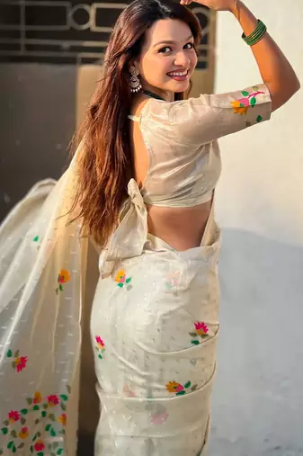Cream with multicolor accents  woven zari floral motifs work   paithani style saree