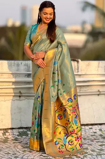 Light green with multicolor accents  woven zari floral & peacock motifs  silk blend  