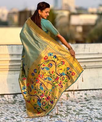 Light green with multicolor accents  woven zari floral & peacock motifs  silk blend   2